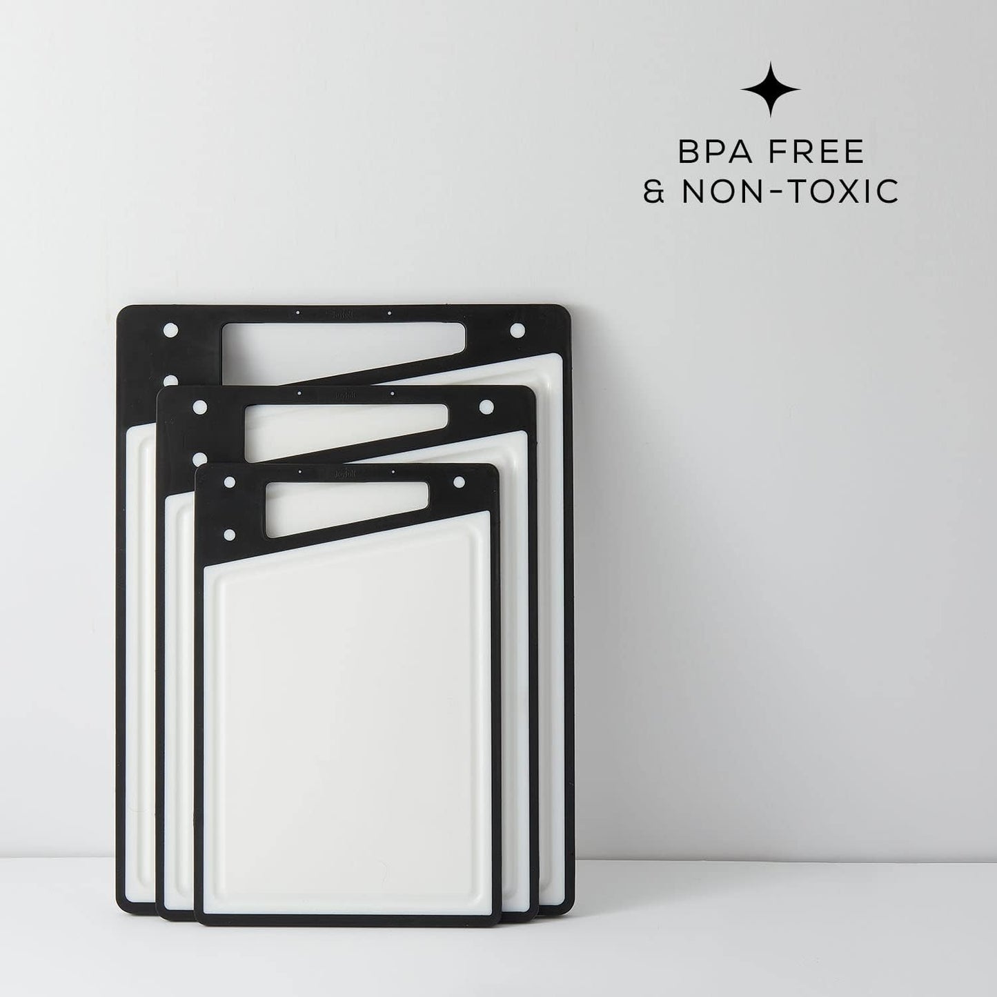 JoyJolt Plastic Cutting Board Set. White and Black Cutting Boards for Kitchen Dishwasher Safe with Handle. Non Slip Large and Small Chopping Board Set; Meat Cutting Board with Juice Groove.