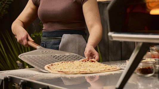 ooni 12” Signature Perforated Pizza Peel – Anodised Aluminum Metal Pizza Peel 12 Inch With Long Walnut Wood Handle, Pizza Spatula Paddle, Pizza Oven Accessories, Pizza Tools