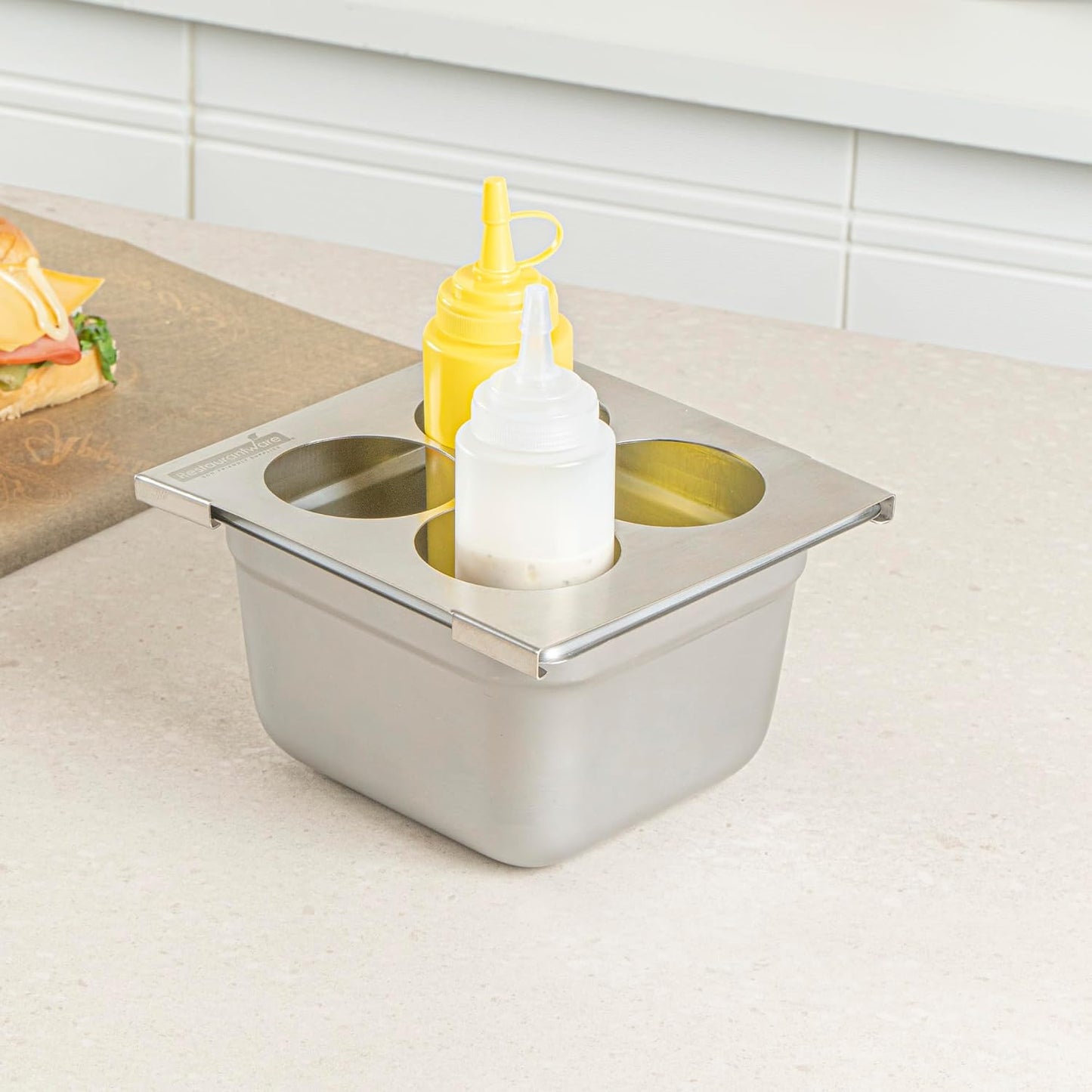 Restaurantware Stainless Steel Bottle Organizer - 1 Count - 6.299 x 7.087 x 0.394 Inches - Dishwasher-Friendly Condiment Holder - Kitchen Bottle Rack - Space-Saving Design - Silver