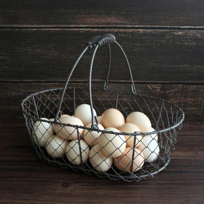 CVHOMEDECO. Oval Metal Wire Egg Basket Wire Fruit Basket with Handle Primitives Vintage Style Storage Basket. Rusty, 11 X 7-1/4 X 3-1/2 Inch